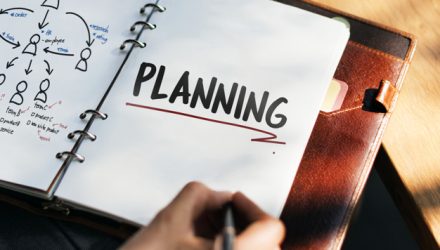 Woman writing and planning business strategy